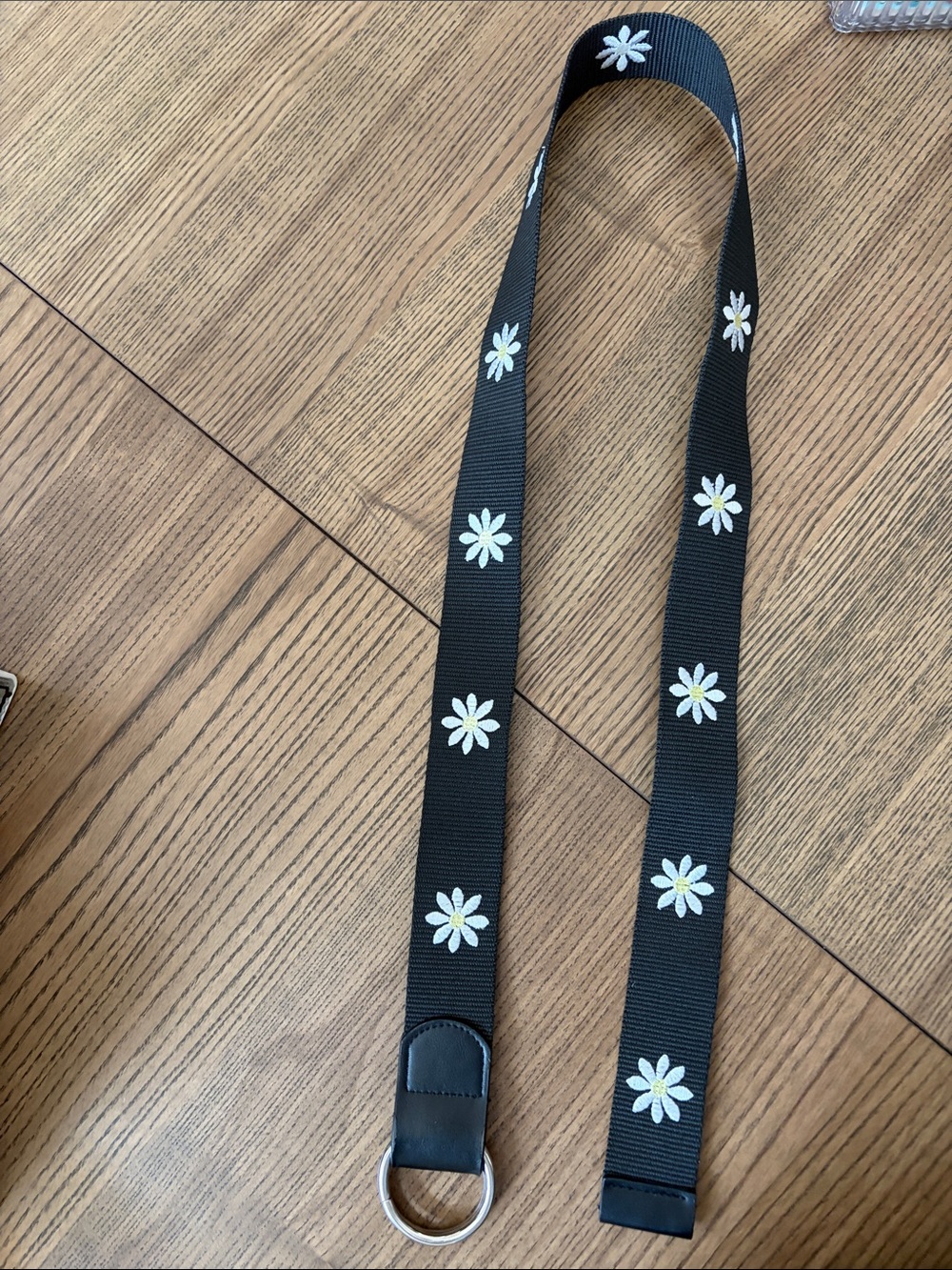 Black Webbed Belt with White Daisy Embroidered Design and Silver Ring Closure